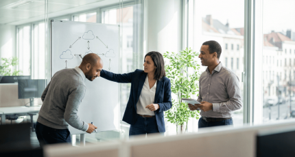 Small IT team evaluating SASE architecture options in a modern European office meeting room